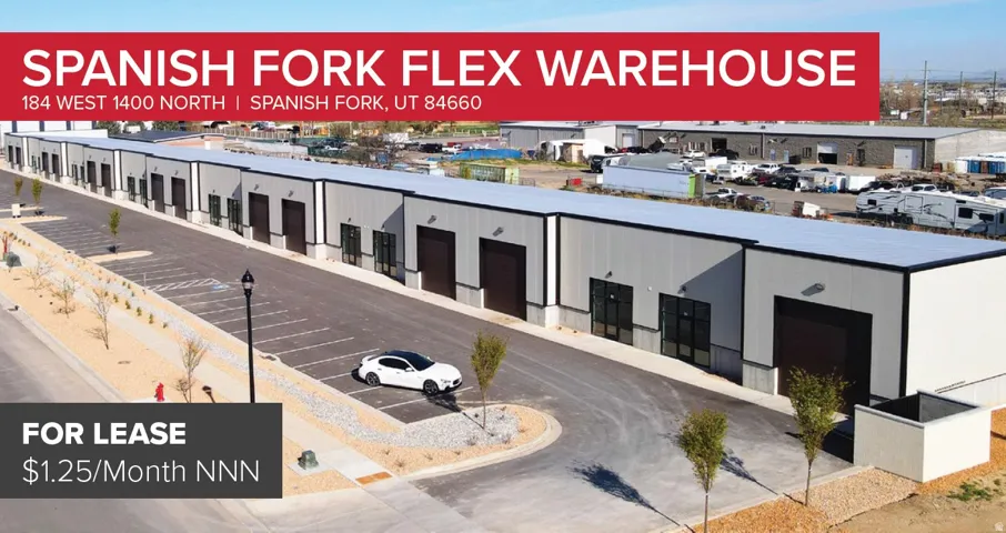 Modern flex warehouse facility with multiple units, each featuring a roll-up bay door and separate entrance
