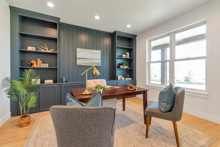 Built-in shelving and cabinetry along a shiplap accent wall, recessed lighting, and light wood-finish flooring