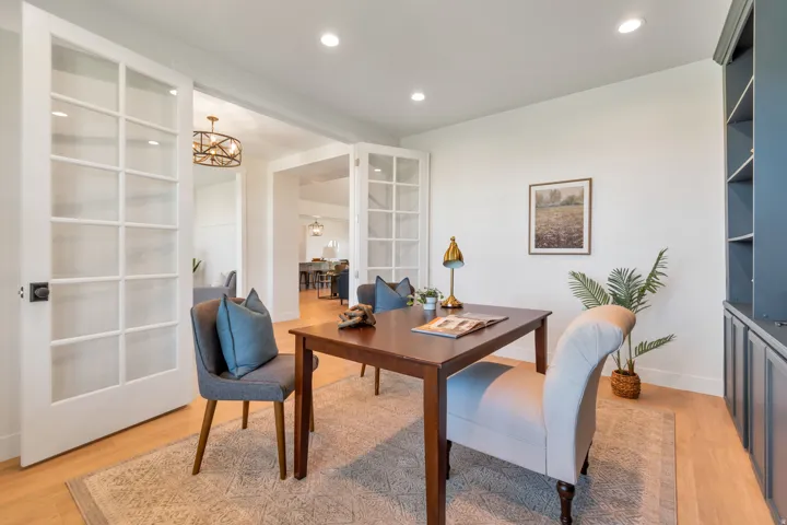 Room featuring double French doors, recessed lighting, and wood-finish flooring