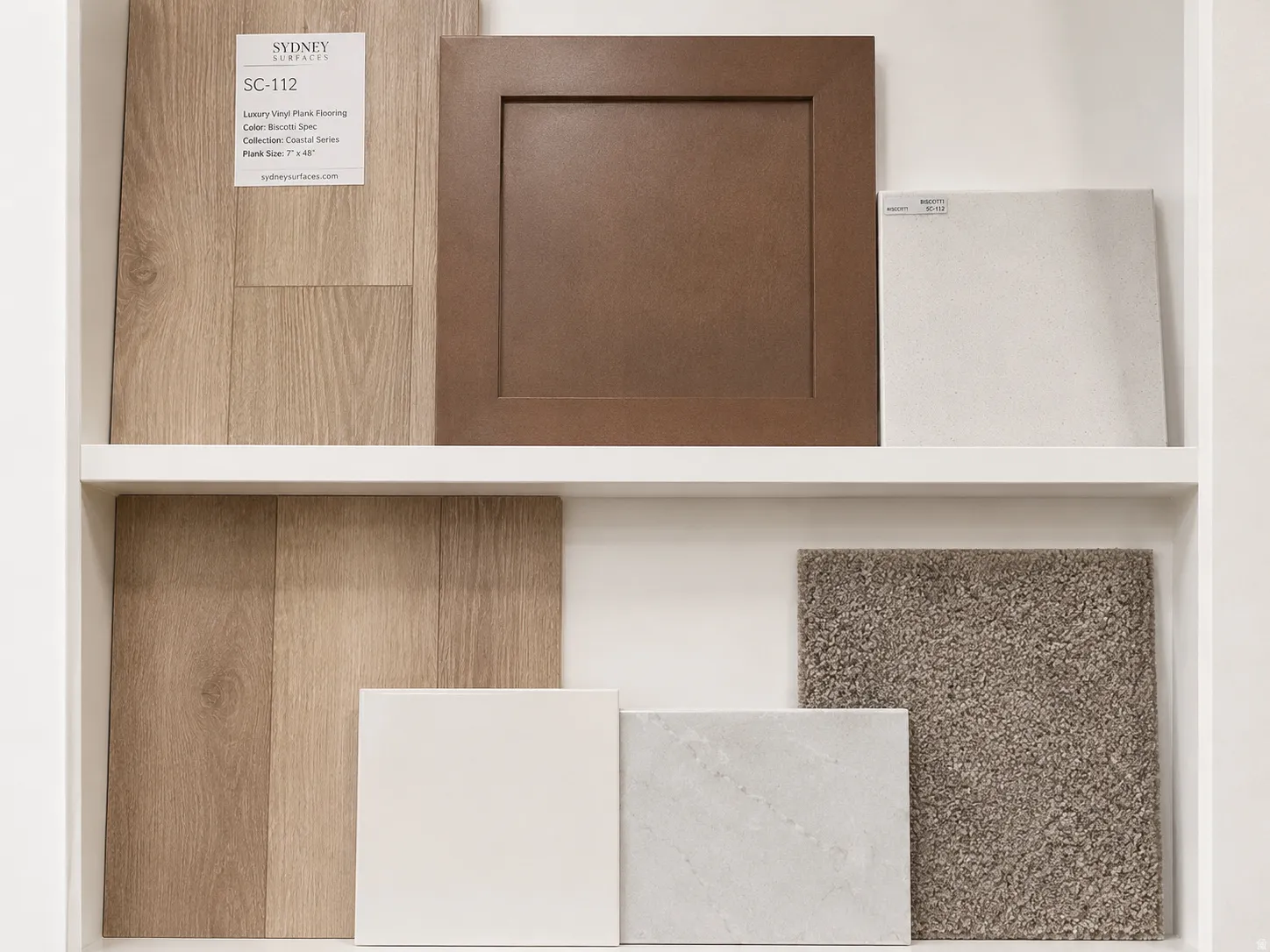 Selection of interior finishes including cabinets, quartz countertops, carpet and LVP flooring.