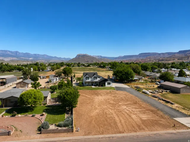 Expansive developable lot with a clear, level ground surface