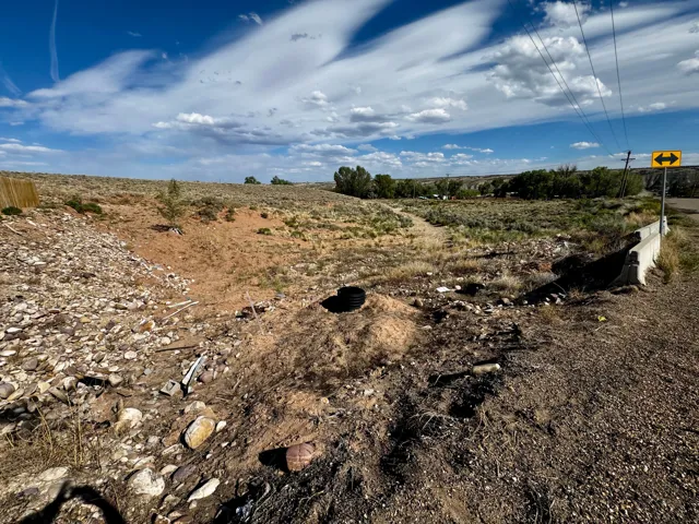 Unimproved land parcel featuring diverse topography and natural vegetation