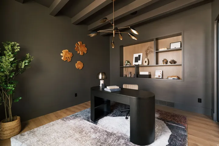 Hardwood-style flooring with a decorative area rug