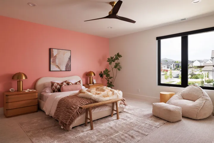 Spacious room featuring a large window, a ceiling fan, recessed lighting, and soft carpet flooring