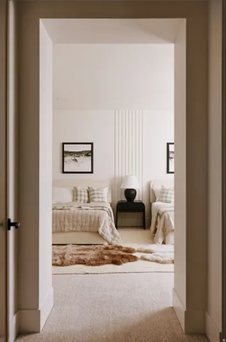 Spacious room with plush carpet flooring, showcasing a textured accent wall paneling