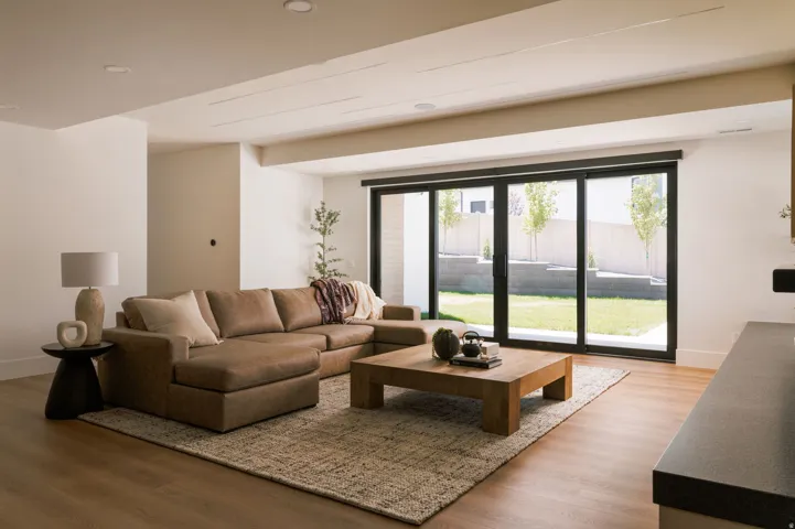 Living area featuring wood-finish flooring, recessed lighting, and a neutral color palette