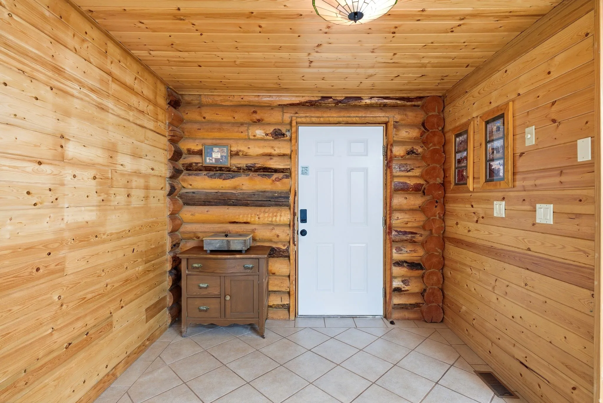 Entryway featuring natural wood walls and ceiling