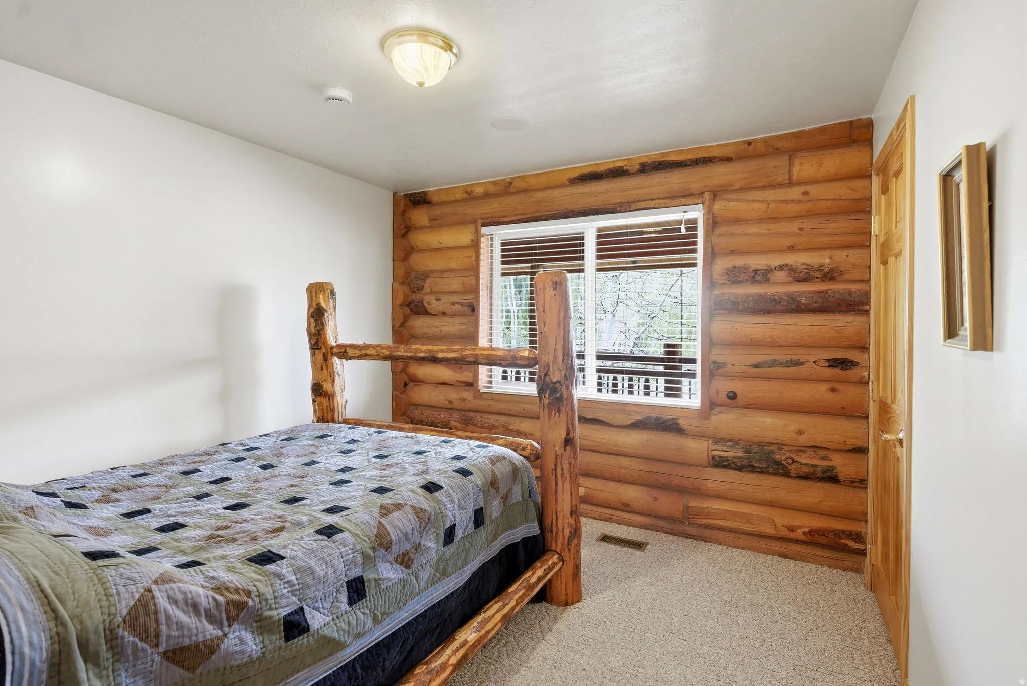 Accent wall featuring horizontal log paneling