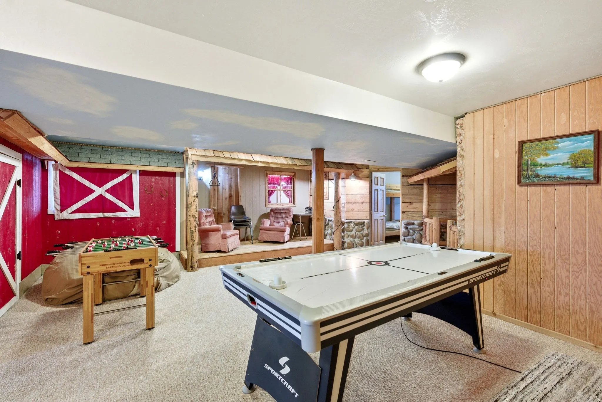 Recreation room featuring air hockey table and carpet flooring