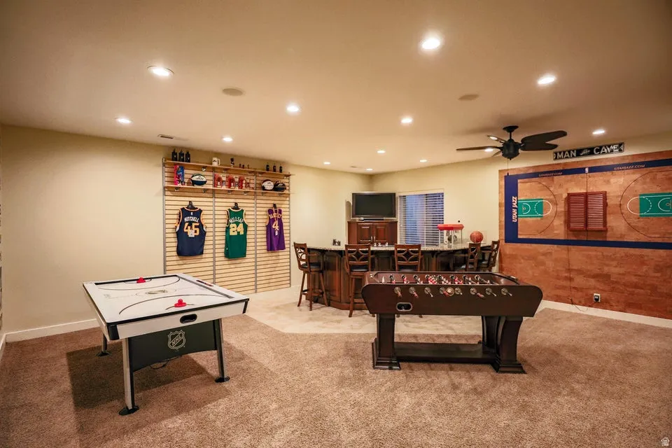 Recreation room featuring recessed lighting, a ceiling fan, and carpet flooring