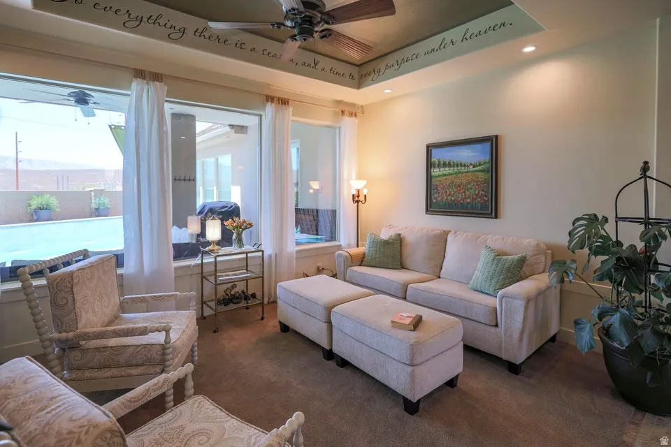Recessed lighting illuminates a tray ceiling featuring decorative script