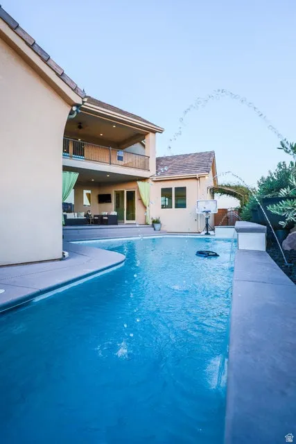Inviting inground swimming pool with integrated water features