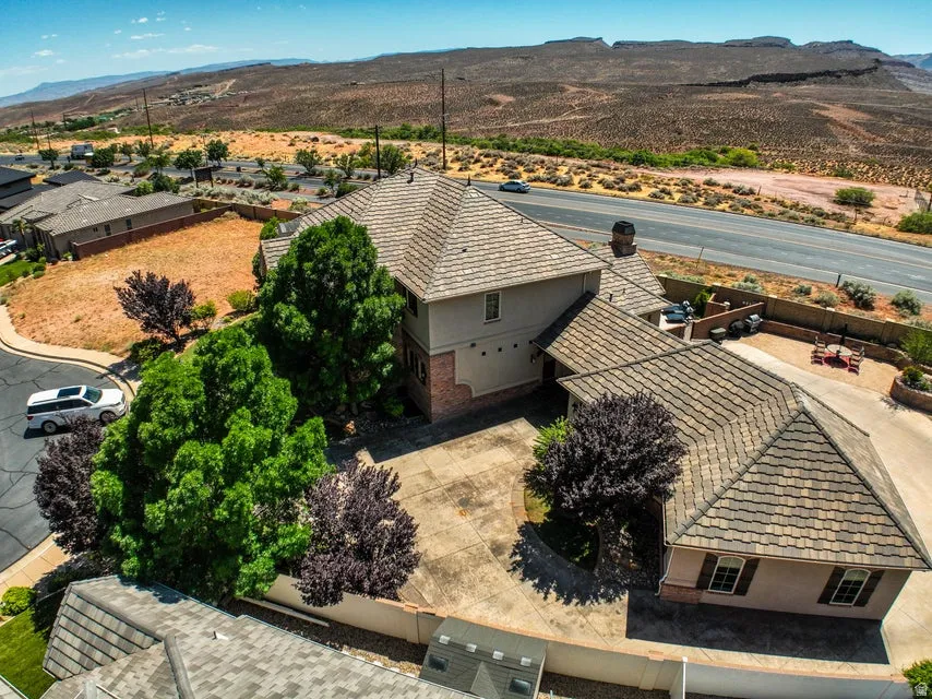 Property exterior featuring a tiled roof and stucco finish