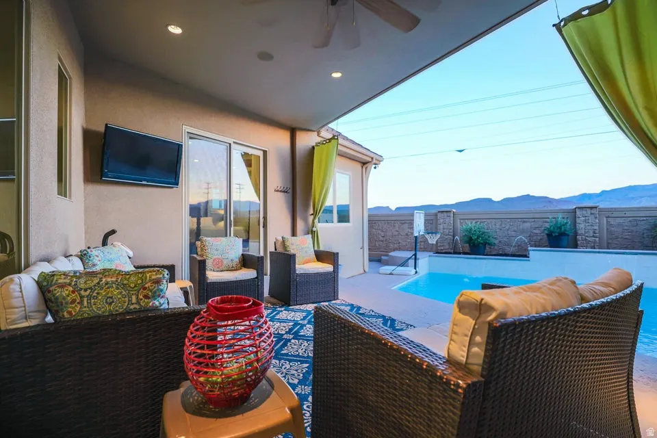 Covered patio featuring a ceiling fan and recessed lighting