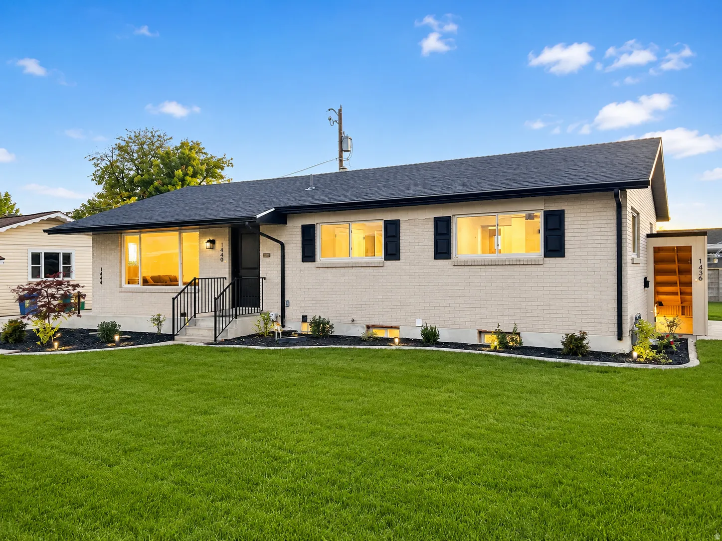Modern single-story residence featuring a light-colored brick exterior