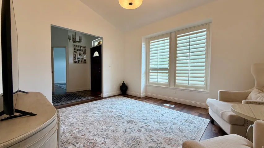 Bright living area featuring wood-finish flooring and a neutral color palette