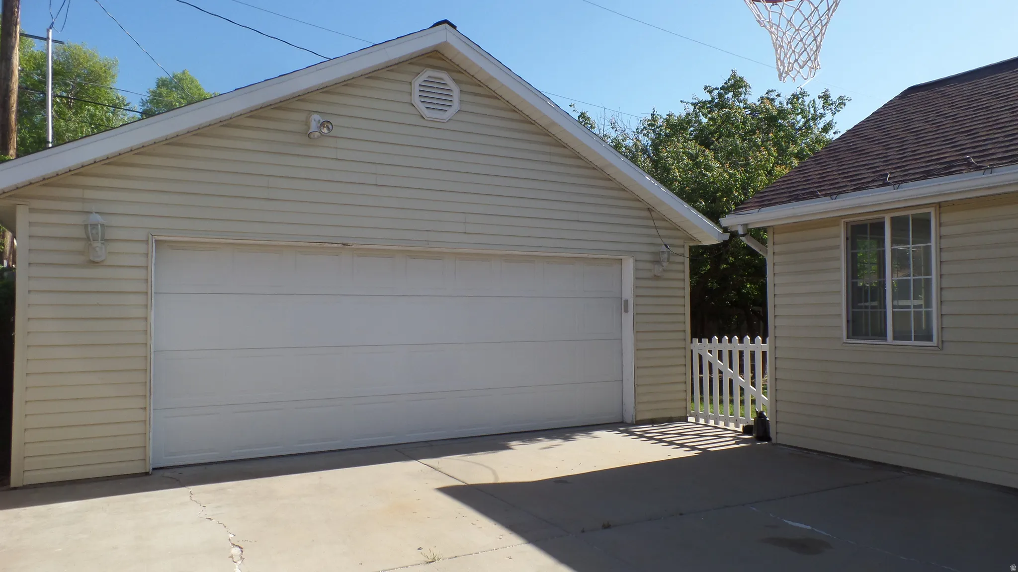 Extra Wide Detached 2-Car Garage with Carport Next to House & Parking for 6 Cars