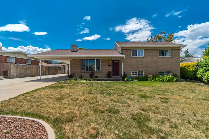 Front of Home - Attached Carport & Lots of Parking