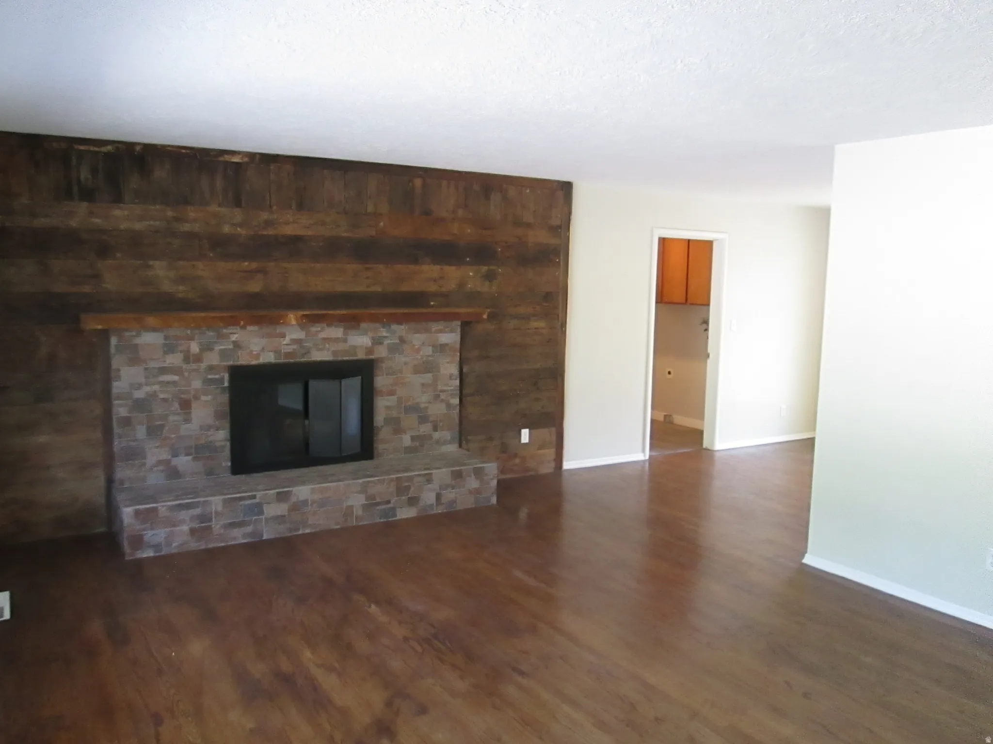 Wood-finish flooring throughout