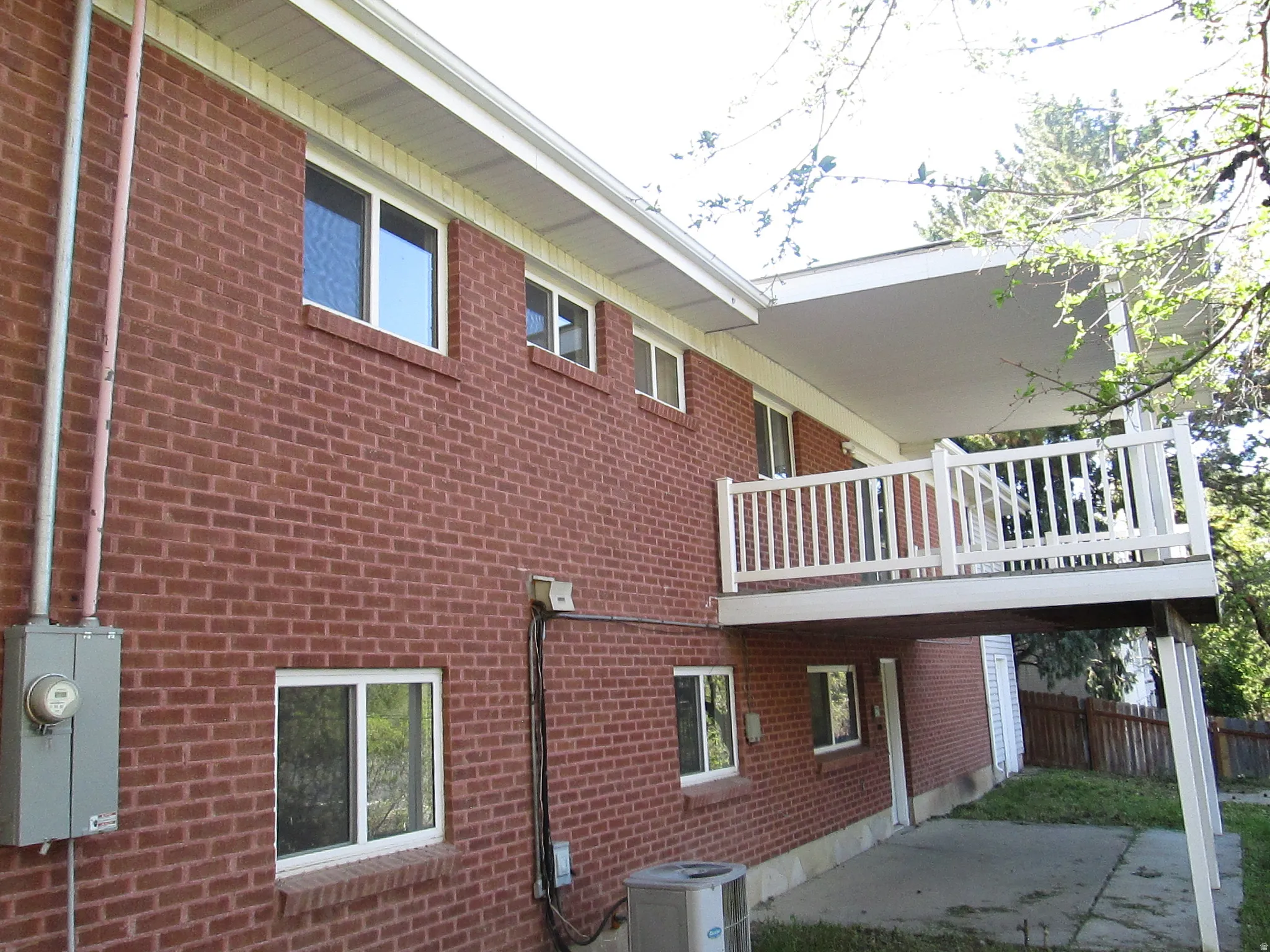 Red brick exterior with multiple windows