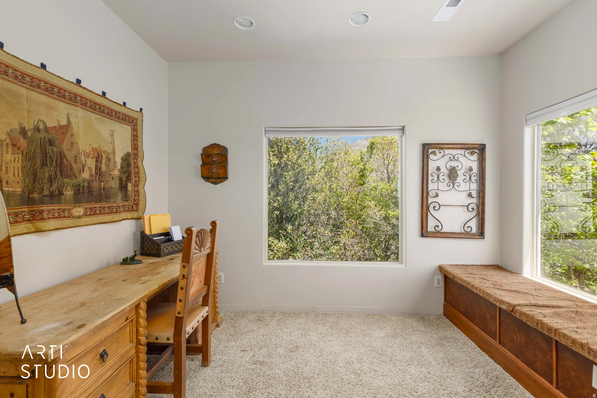 Room featuring multiple windows, recessed lighting, and light-colored carpeting