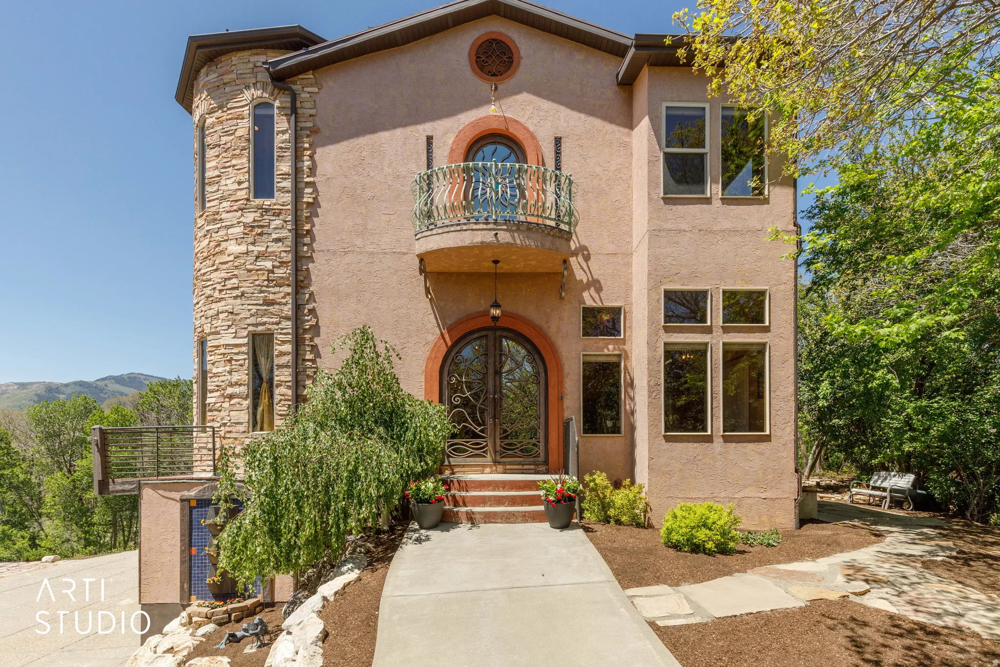 Stucco exterior with a stone-clad turret