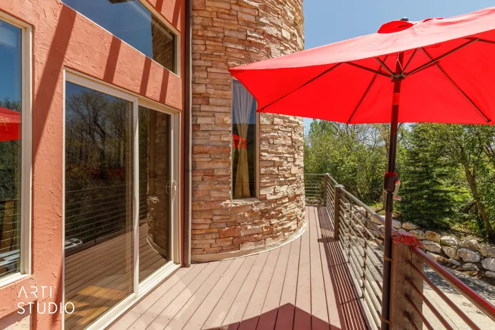 Exterior deck with wood-finish flooring and modern metal railings