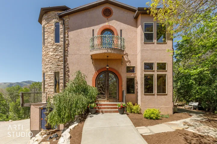 Stucco exterior with a stone-clad turret