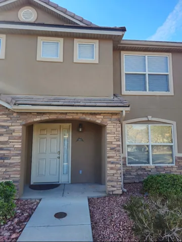 Stucco exterior with stone veneer accents