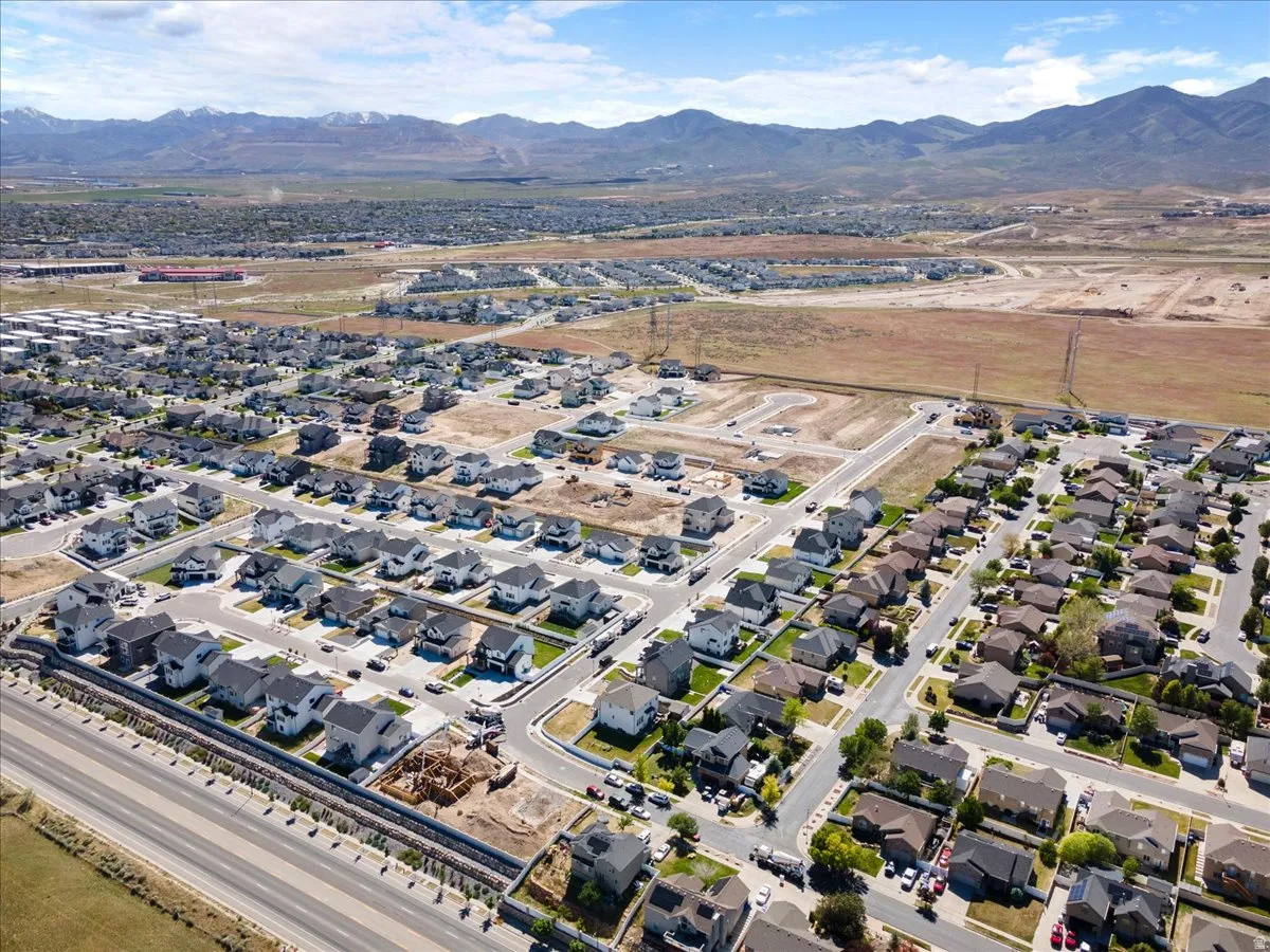 Expansive aerial perspective showcasing a residential community with varied architectural styles