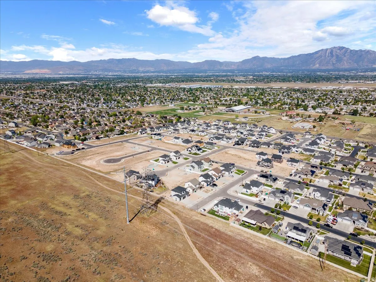 Aerial perspective showcasing a residential development with established homes and newly developed lots