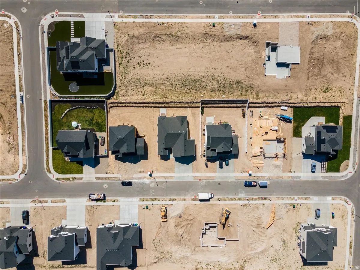 Aerial view showcasing a developing neighborhood with both completed and under-construction properties