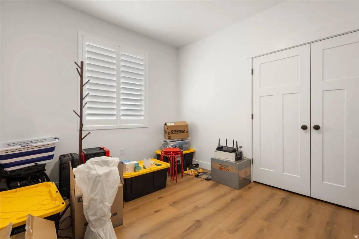 Room featuring wood-finish flooring and neutral wall tones