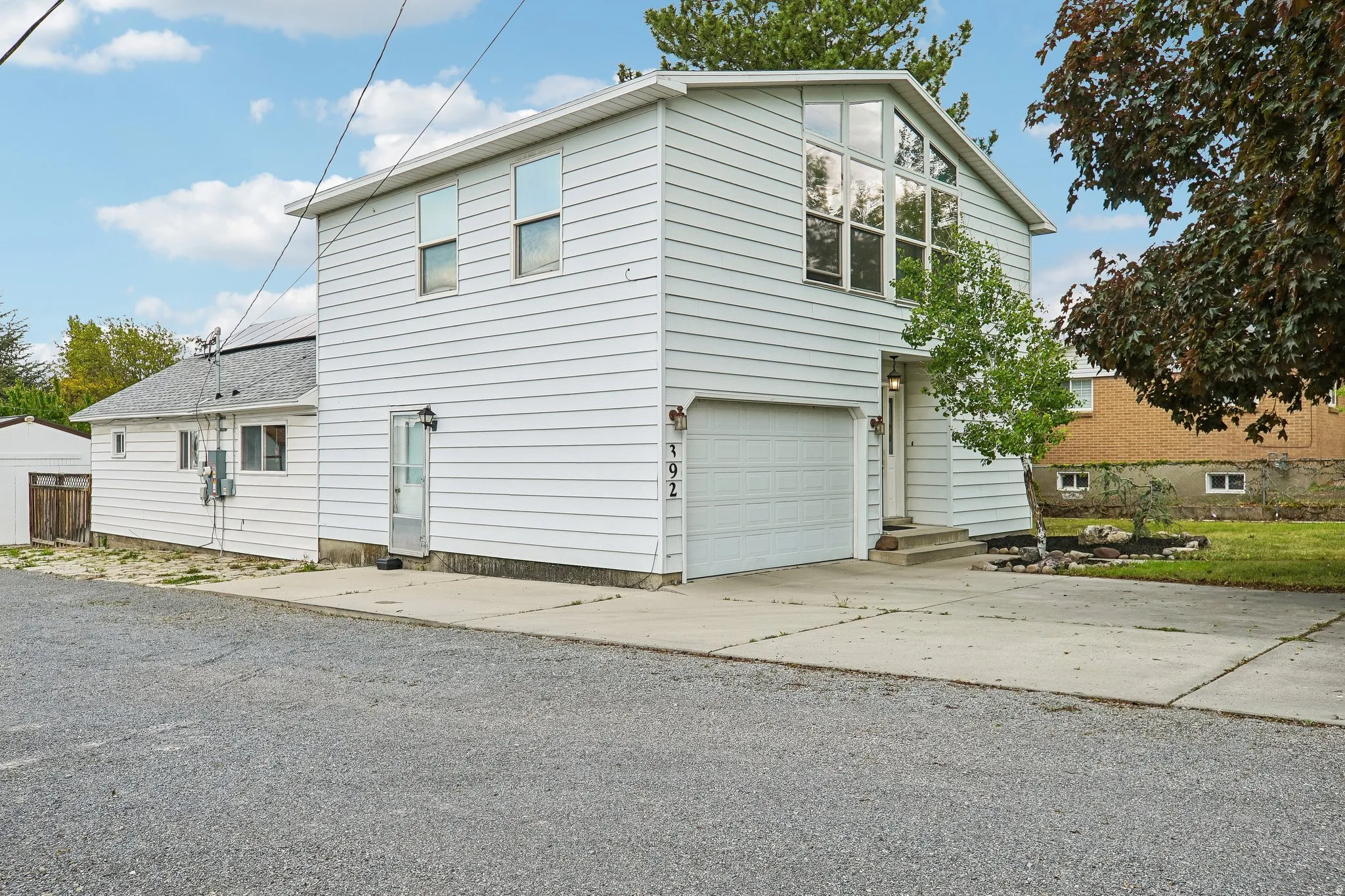 Full home view with 1-car attached garage