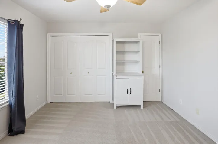 Neutral tone walls and carpeting create a versatile interior