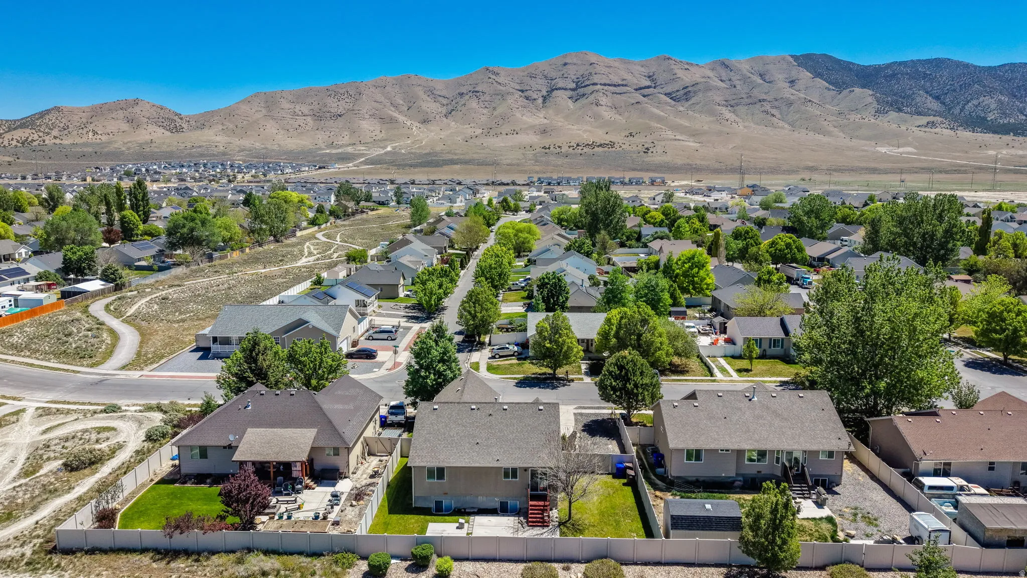 Suburban neighborhood setting with established homes and mature trees