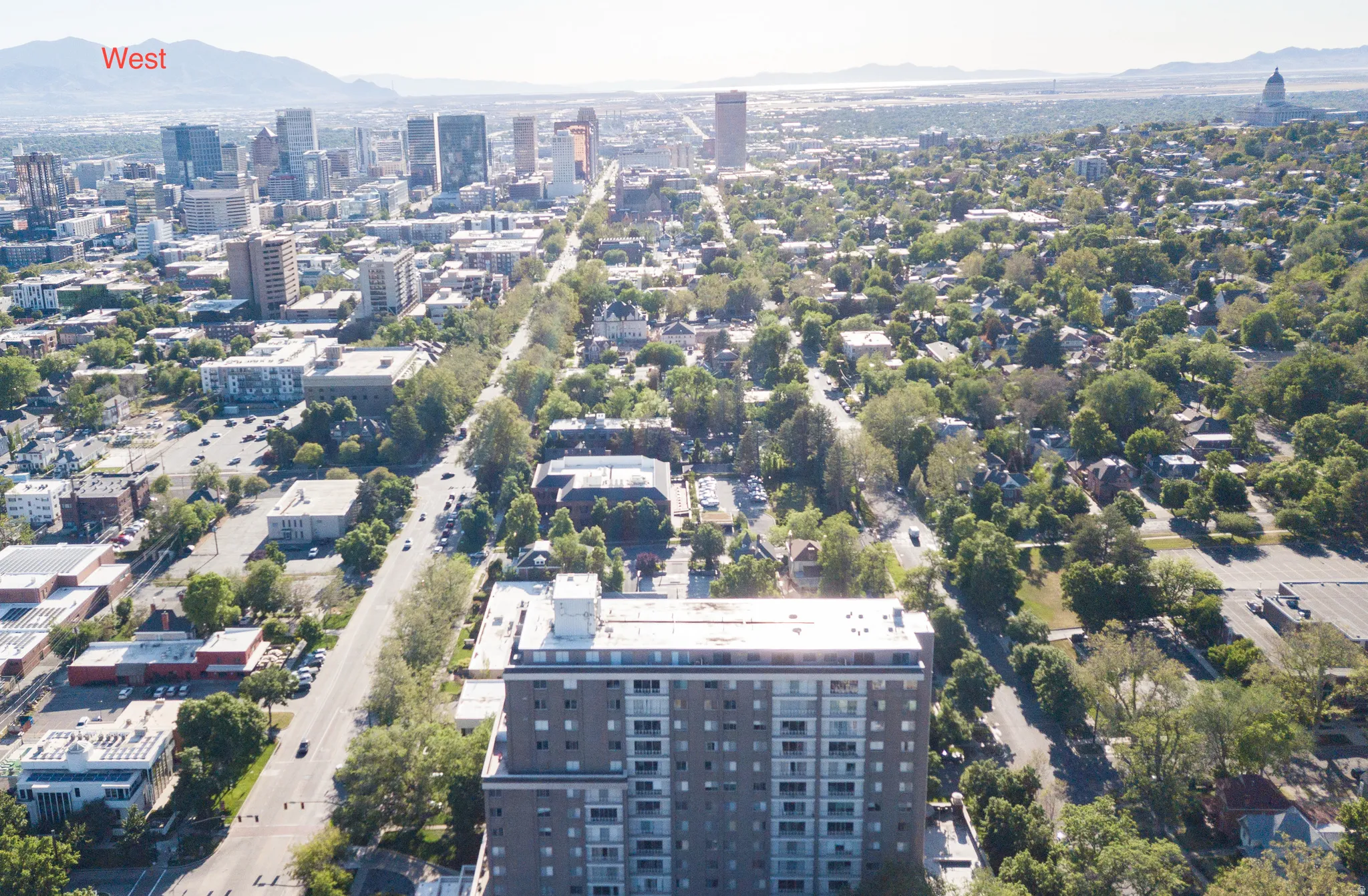 Aerial perspective of a metropolitan area featuring a dense urban core and surrounding residential neighborhoods