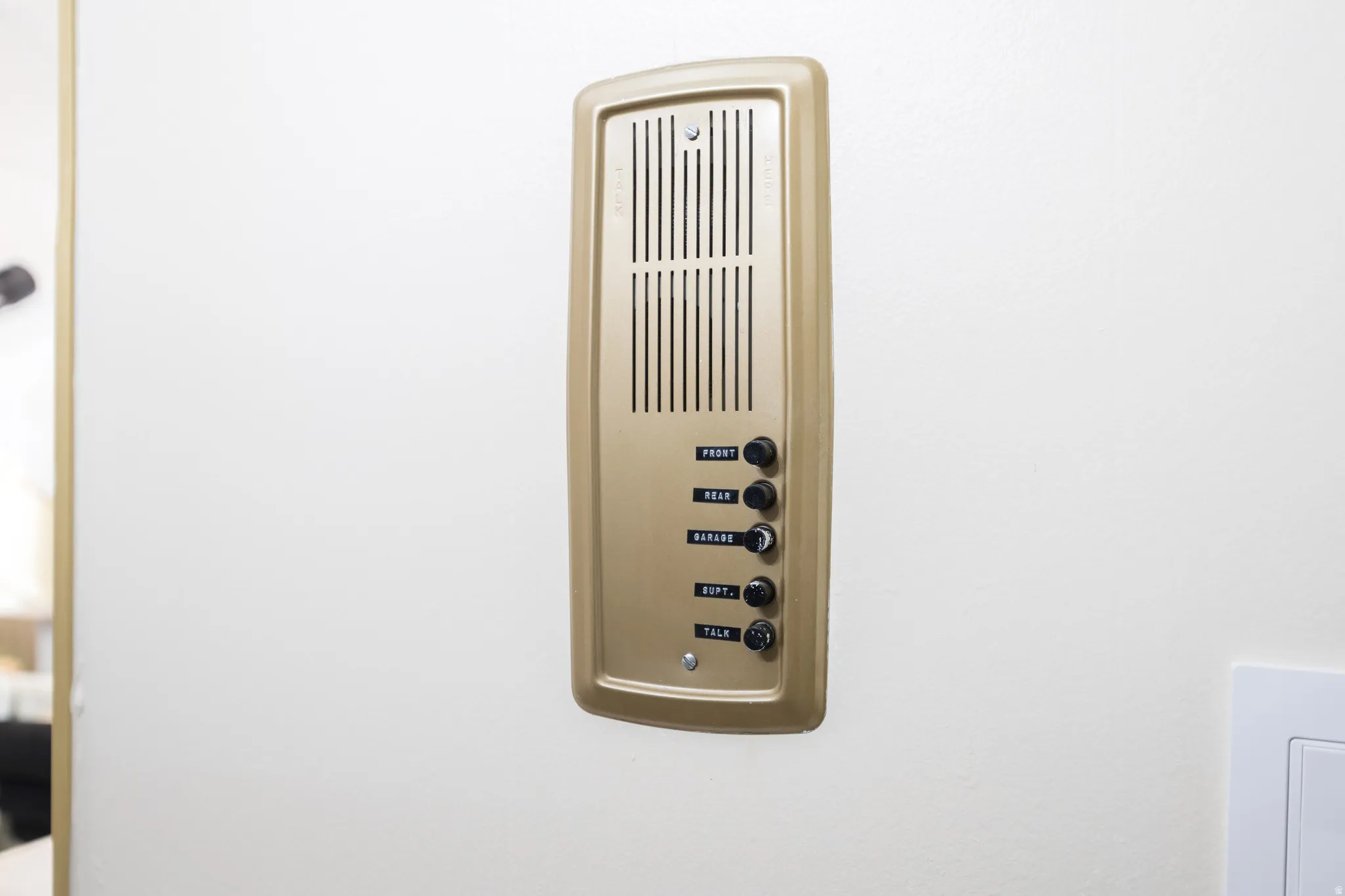 Vintage intercom system with a gold-tone finish
