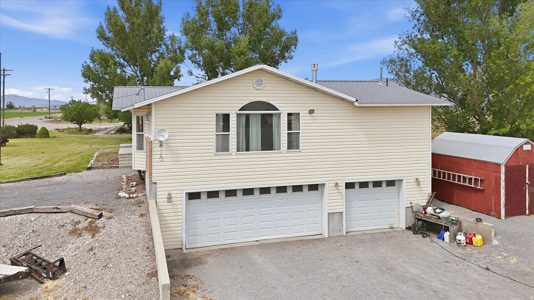 Three car garage with recreation room above