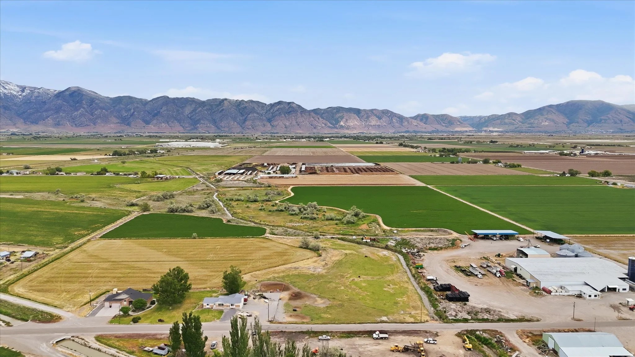 Expansive agricultural land featuring a mix of cultivated fields and undeveloped parcels