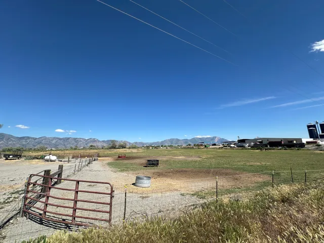 Expansive open land with a mountain backdrop
