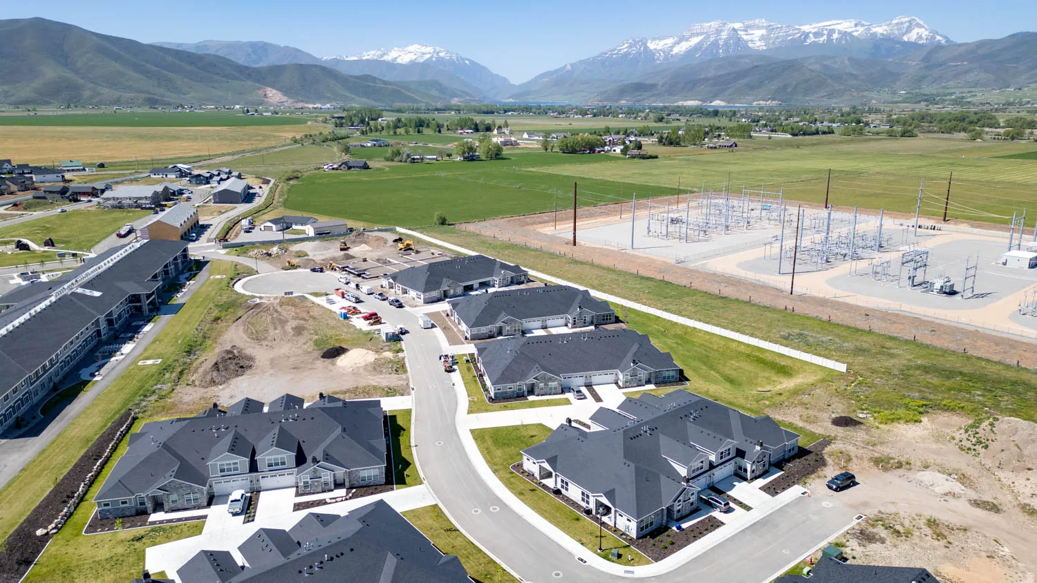 Aerial perspective showcasing a developing residential community with new construction properties