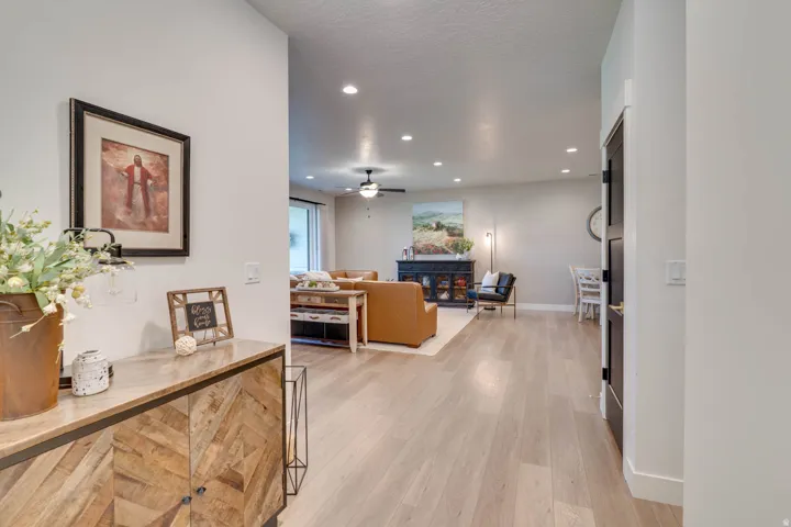 Light wood-finish flooring extending through open-concept living areas
