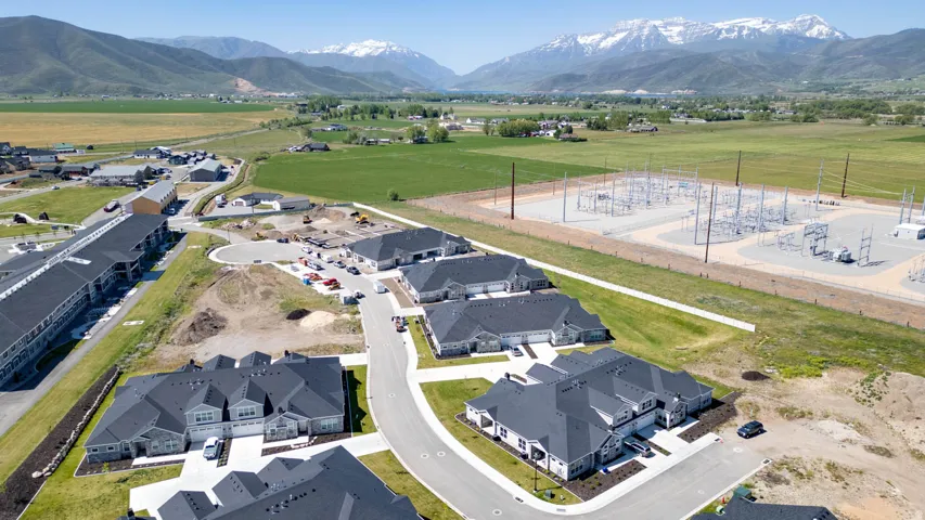 Aerial perspective showcasing a developing residential community with new construction properties
