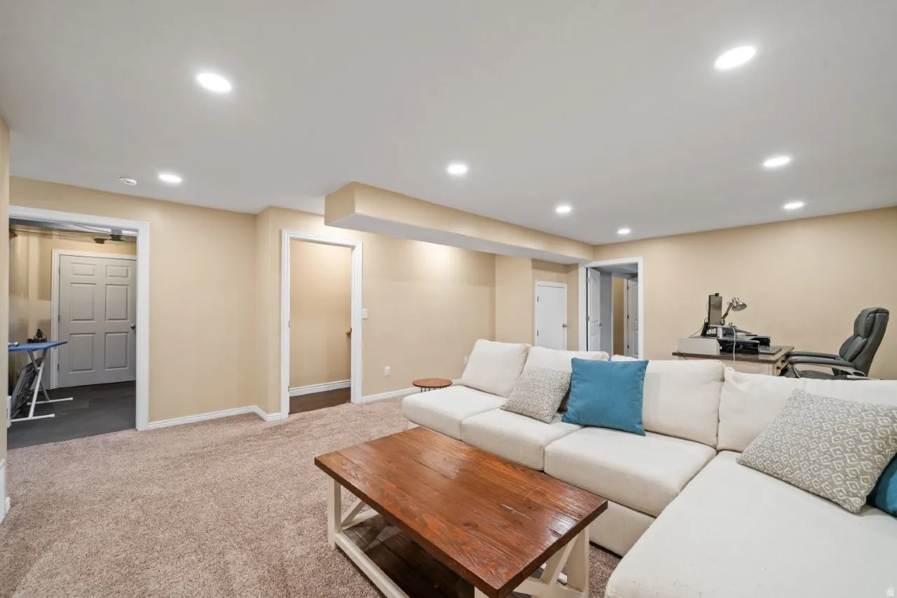 Spacious lower level featuring recessed lighting, neutral paint, and light brown carpeting