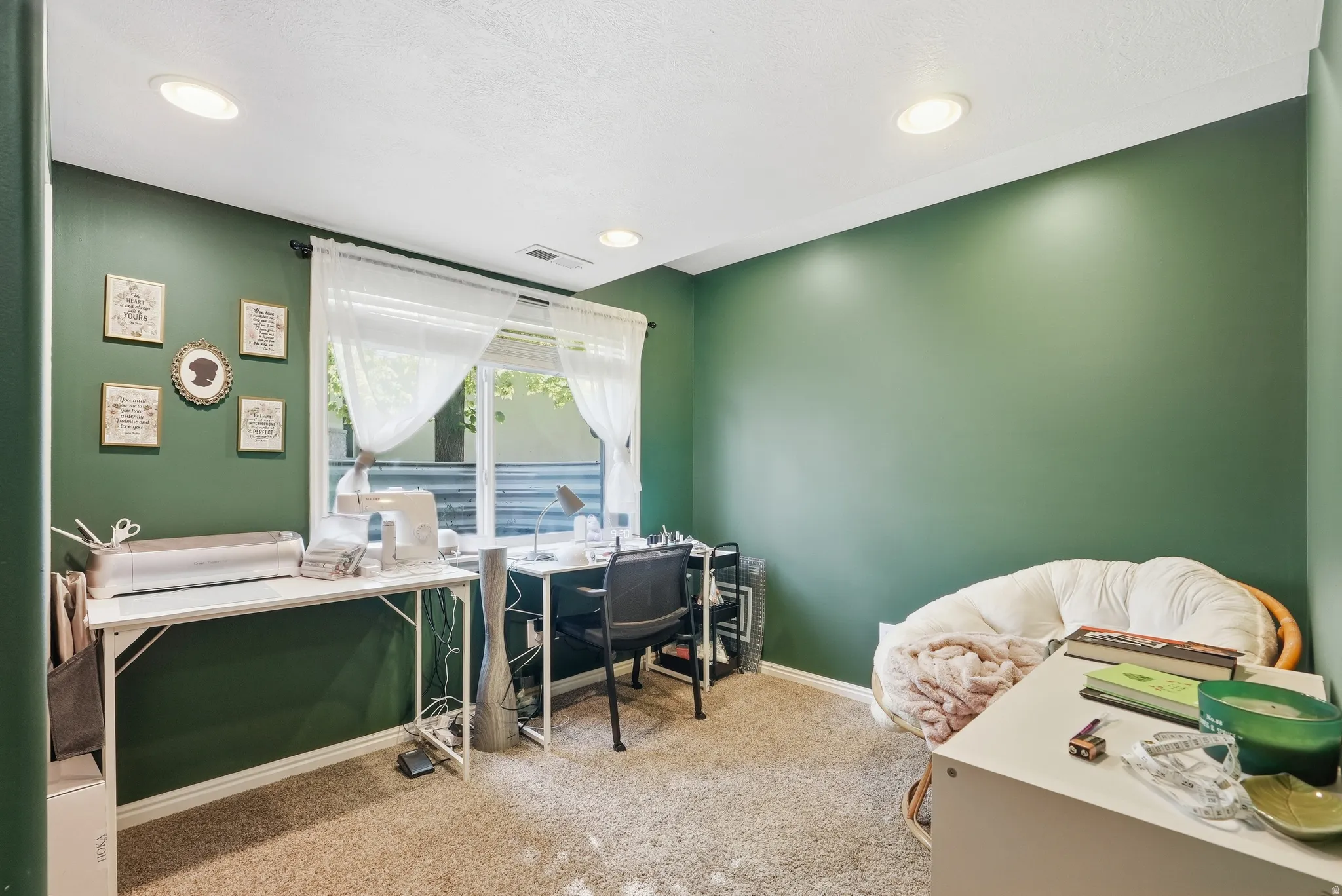 Room featuring recessed lighting, a window with white sheers, an upper wall vent, and neutral carpet flooring