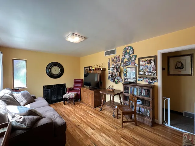 Living area featuring wood-finish flooring