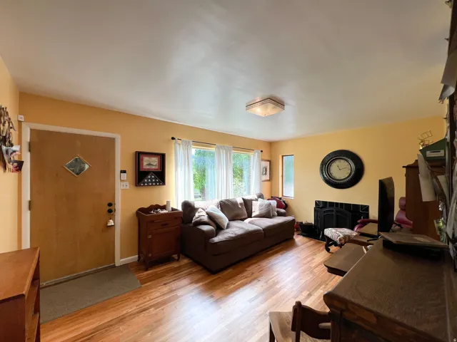 Living space featuring wood-finish flooring