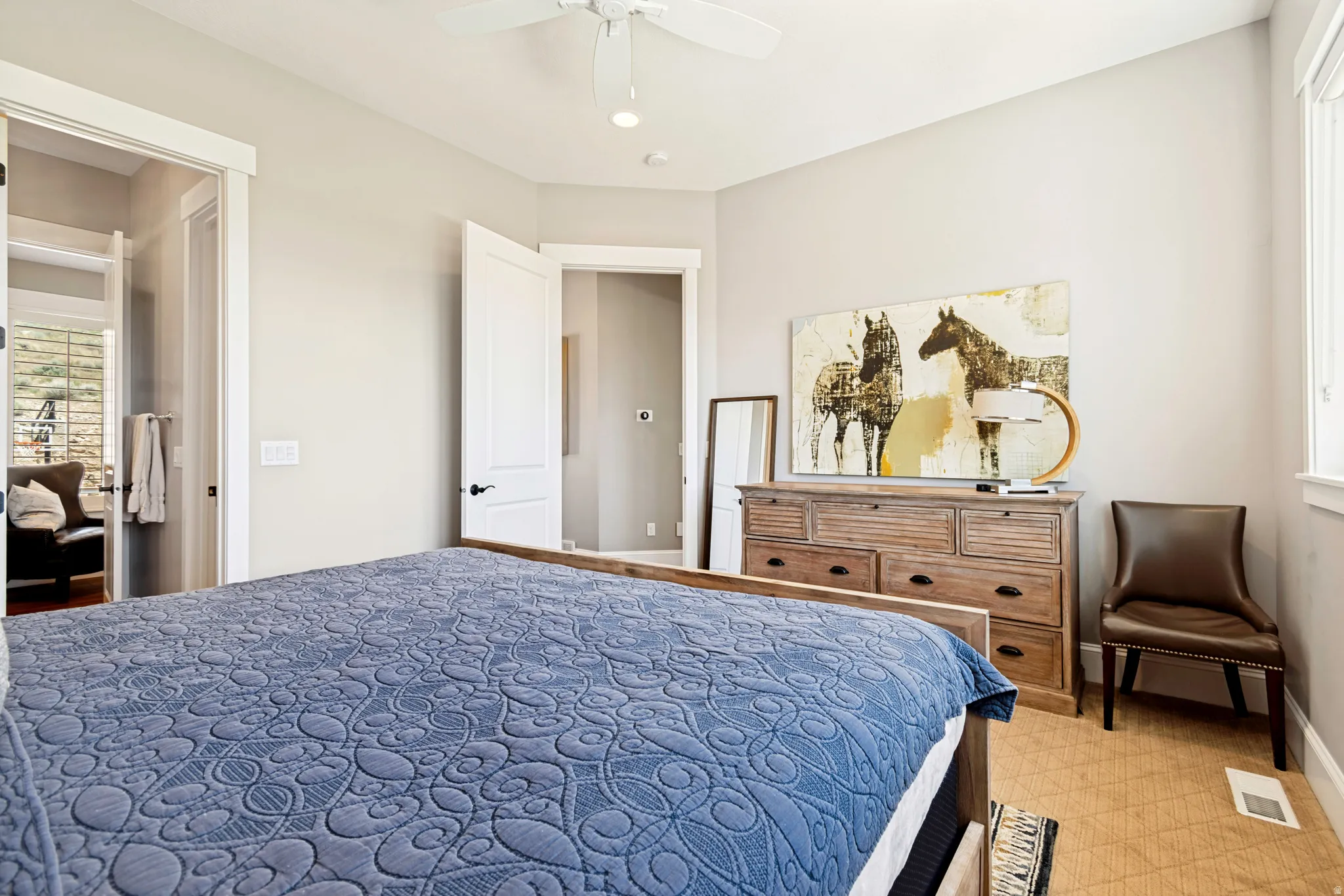 Bedroom featuring a white ceiling fan, recessed lighting, and a window with white trim