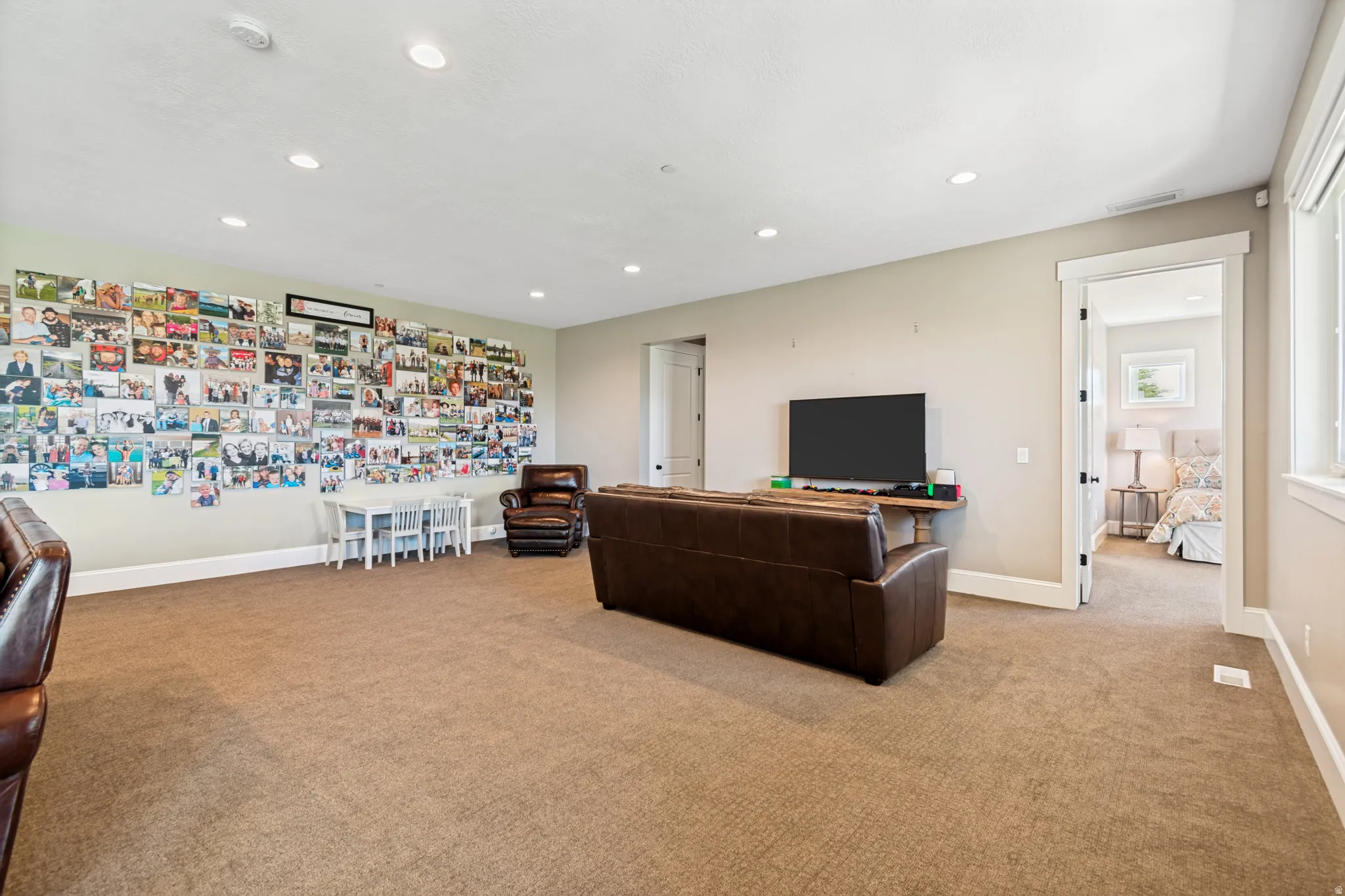 Spacious carpeted room featuring recessed lighting and light-toned wall paint